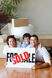 Family on the floor after buying house with copy-space