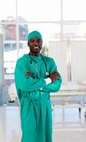 Friendly Afro-American surgeon looking at the camera