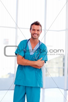Smiling handsome doctor isolated in hospital