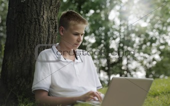 Young man using laptop i
