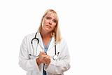 Concerned Female Blonde Doctor or Nurse with Hands Folded Isolated on a White Background.