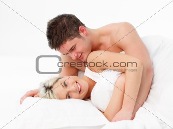 Couple in love lying in bed