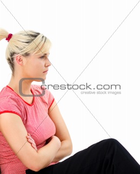 Worried woman sitting on the floor