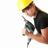 Young woman builder with driller