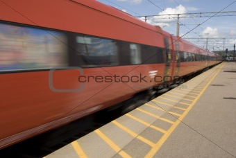 Fast going red train. Motion blur