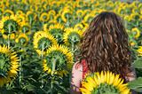Woman in the field of sunflowers