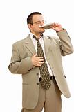 Businessman drinking from a flask