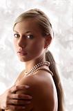 blond woman with pearl