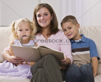 Woman Reading to Children