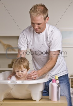 Father Giving Daughter Bath