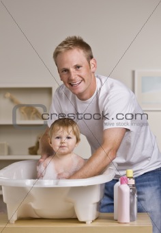 Father Giving Daughter a Bath