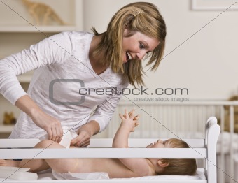 Woman Changing Baby