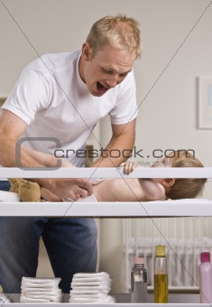 Father Changing Diapers