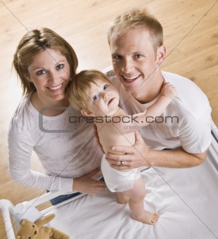 Couple with Baby on Changing Table