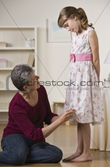 Grandmother Hemming Granddaughter's Dress