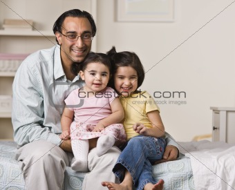 Father Sitting with Daughters