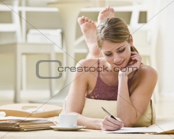 Woman Writing on Files