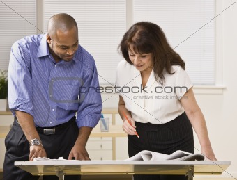 Man and Woman Working in Office
