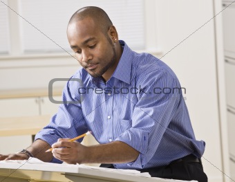 Man Working on Blueprints