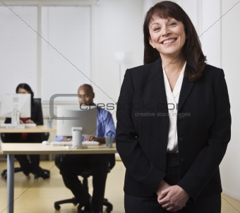 Woman in Office with Co-workers