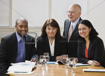 Four business workers smiling