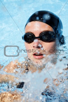 Swimmer in the water with spray
