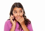 Shocked Pretty Hispanic Girl On Cell Phone Isolated on a White Background.