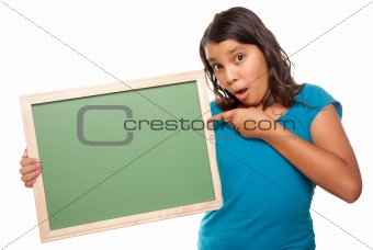 Pretty Hispanic Girl Pointing and Holding Blank Chalkboard Isolated on a White Background.