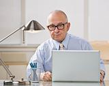 Older man on laptop.