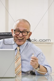 Senior male happy with USB.
