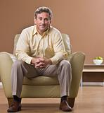 Man Sitting in Living Room