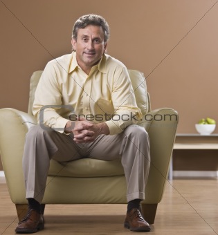 Man Sitting in Living Room