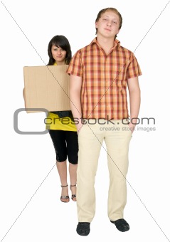Woman and man bear the big cardboard box