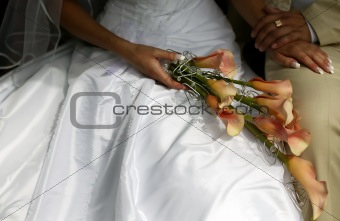 Groom holding bride with flowers