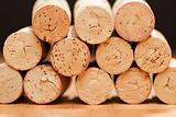 Stack of Wine Corks on a Wood Surface.