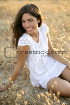 Beautiful indian brunette in a golden field
