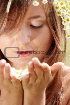 Beautiful young woman on the meadow