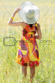 Young happy woman in grain field