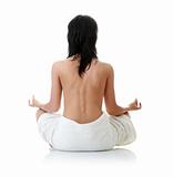Back of a nude beautiful woman meditating