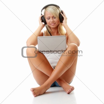 Casual student listening to music on the computer