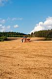 farmer on tractor plowing the field in southern bohemia