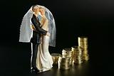wedding couple figurine and golden coins