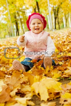 Laughing autumn kid