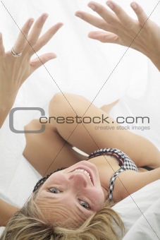 Playful Woman in Bed