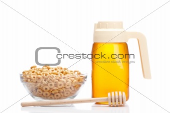 Honey pitcher and bowl of cereals