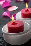 Candle and flower petal decoration.