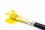  yellow paint and brush