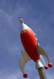 Rocket against blue sky