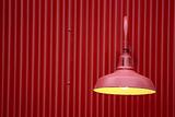 Red light against red metal background