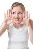 cute woman framing face with hands